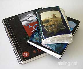 A stack of artists journals